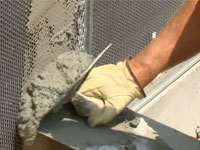 Repairing cracks in stucco